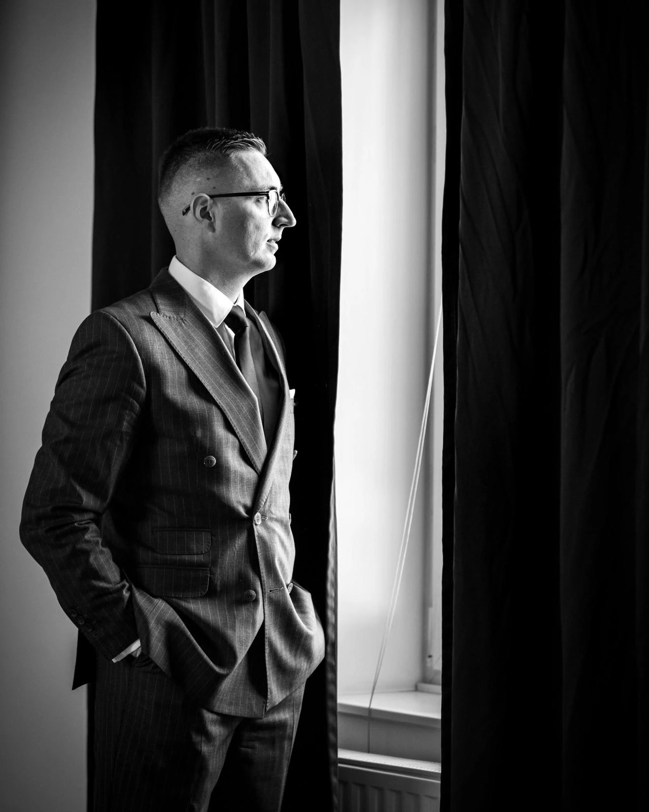 Executive portrait in a quiet black and white interior