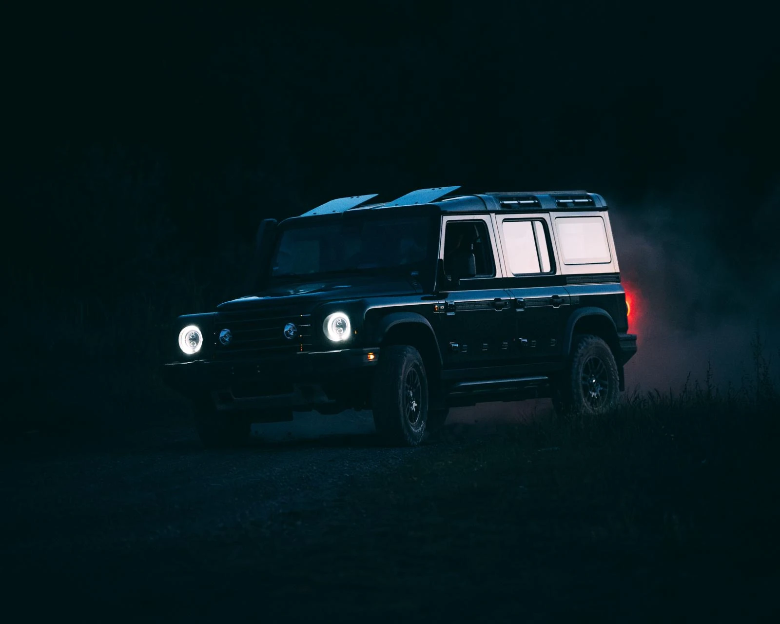 Expedition vehicle at night in a remote landscape