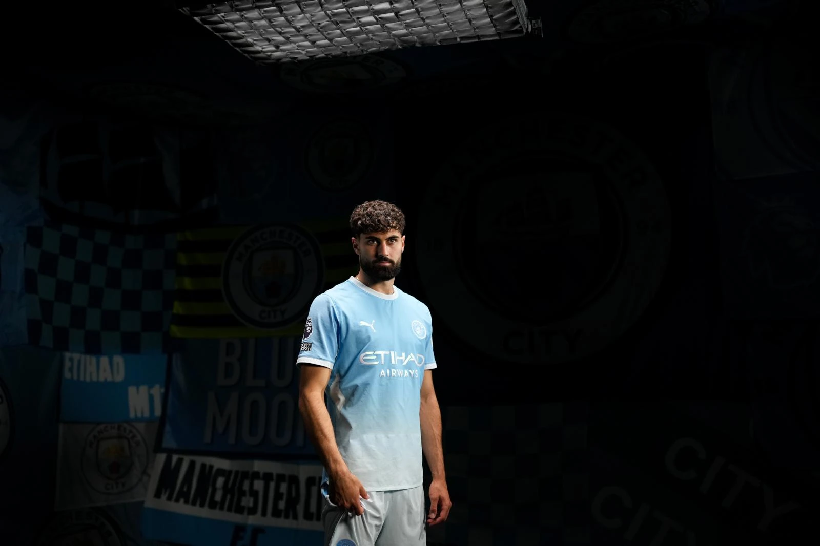 Athlete portrait in a dark media setting